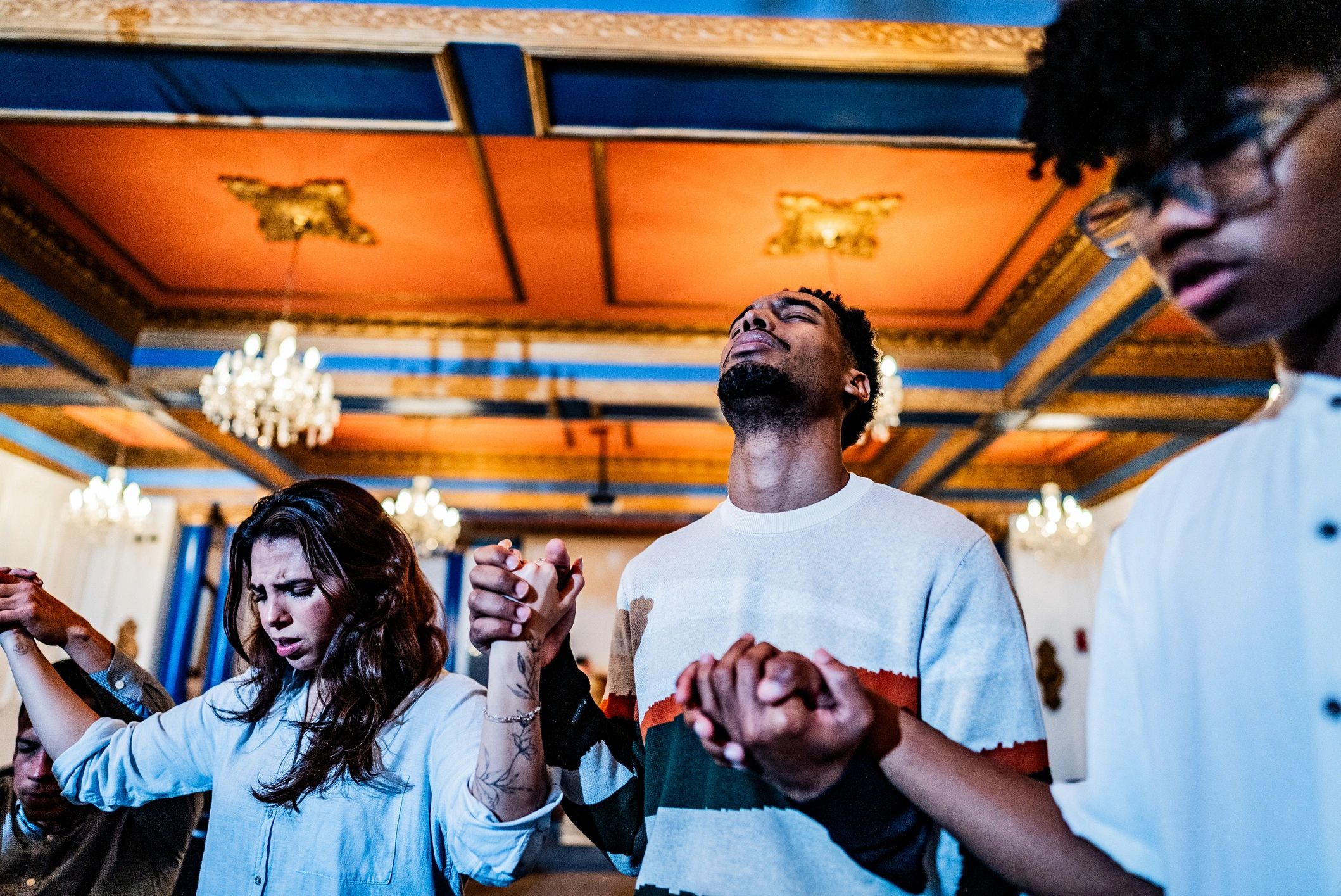People gathered in prayer during a ministry service